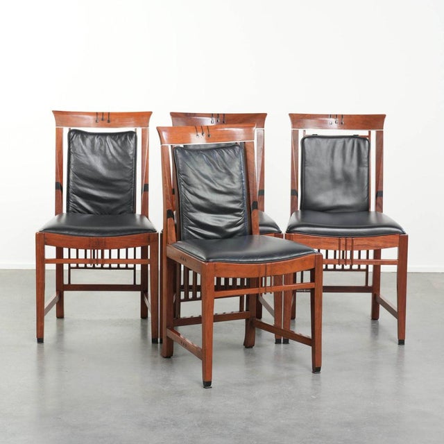 Elegant set of four black cowhide leather and wooden Art Deco dining chairs by Schuitema from the Decoforma series. : This...