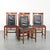 Elegant set of four black cowhide leather and wooden Art Deco dining chairs by Schuitema from the Decoforma series. : This...