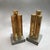 Pair of stunning, modernist, architectural andirons features three graduated, solid brass, hexagonal columns on solid...