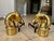 A very handsome pair of brass and cast iron andirons with a horse head motif, also features horse head finials on the...