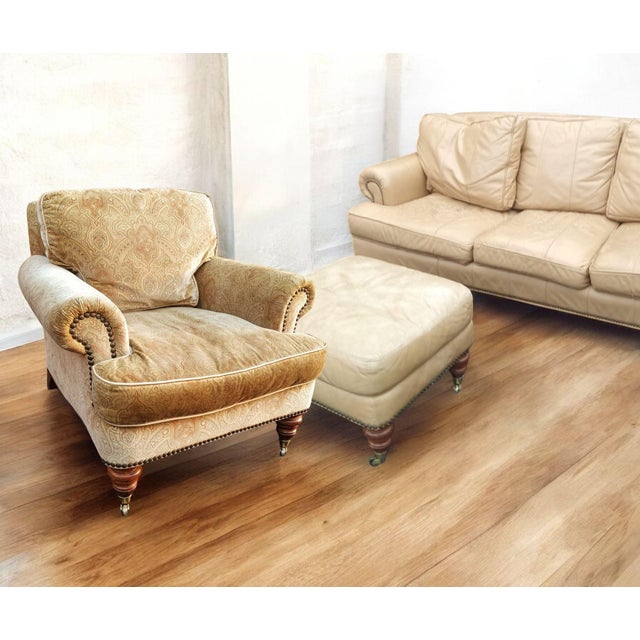 Luxurious Comfort: Sink into the supple, cream-colored leather of the Liz Claiborne sofa, offering both exceptional style...