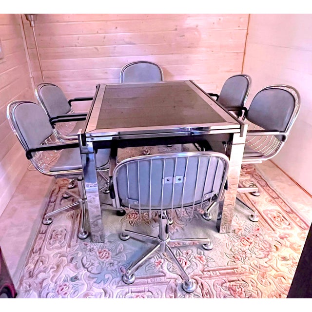 Wonderful Dinning set, with chromed table and chromed armchairs, in Mid-Century Italian Space-Age style, 1970. Both made...
