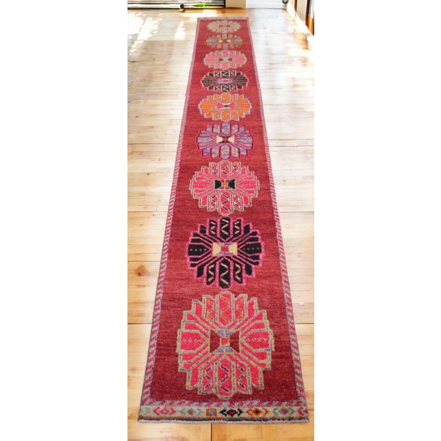 Offered is a bright Kurdish runner rug, made in Anatolia approximately 40-50 years ago. The beautiful wool on cotton pile...