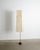 A very rare and early japanese mid century modern floor lamp with the "l1" shade in patinated washi paper with red details...