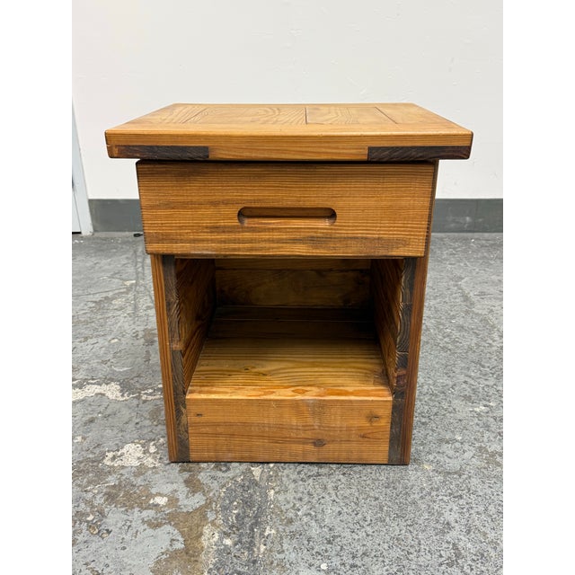 Design Plus Gallery presents a Rustic Pine Wood Nightstand. The single drawer nightstand offers solid wood construction...