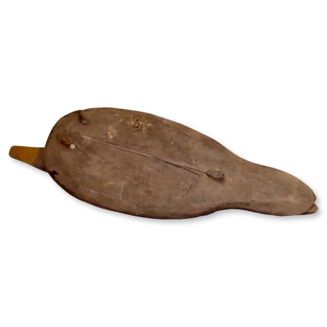 Carefully handcrafted, this antique duck decoy is a true heirloom that has weathered the passage of time, bearing the...