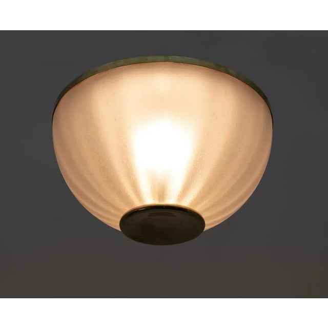 Mid-Century Modern Murano Glass and Brass Ceiling Light, 1970s, in Very Good conditions. Designed 1970 to 1979 European...