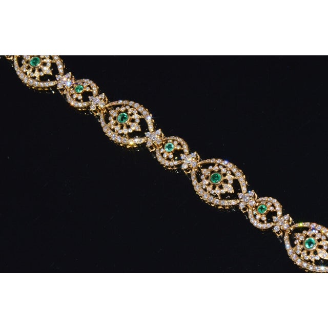 Gorgeous 18K solid gold 5.20CTS diamond and emerald floral bracelet. This stunning statement bracelet is studded with...