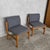 A characterful pair of 1970s Brutalist lounge chairs with chunky pine and oak frames, low relaxed proportions and a...