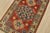 A tribal Caucasian Kazak rug hand-knotted with fine wool on a cotton foundation. This rug features a central medallion...