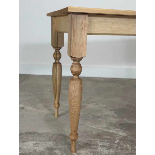 This French harvest table features a stunning Birds Eye maple top, showcasing the wood’s distinctive swirling grain and...