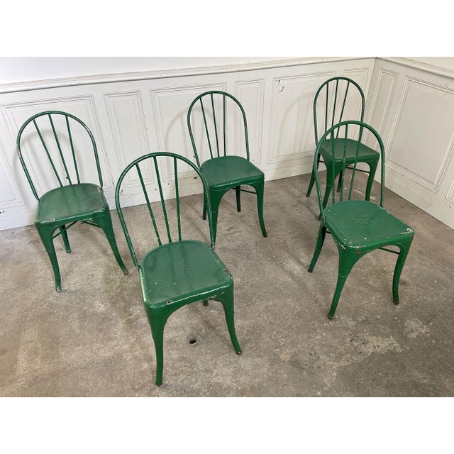 Set of six TOLIX chairs in meadow green, in excellent condition. The "B" model, a staple of bistro terraces in the 1930s,...