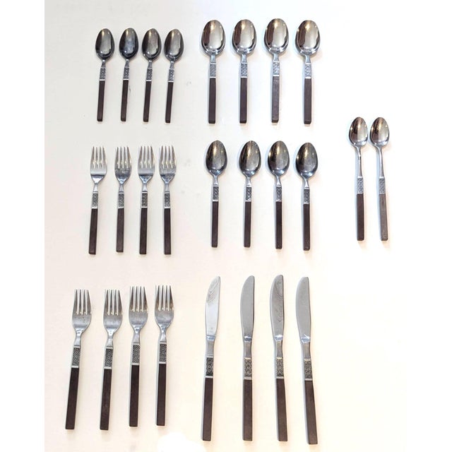 Offered is a vintage 1960s set of 5-piece place settings of Oneida stainless-steel and Teak composite flatware from its...