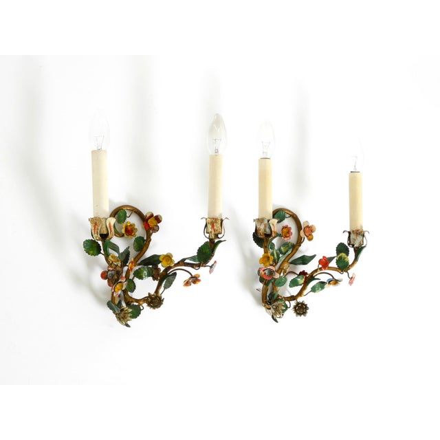 Two beautiful Italian wall lamps from the 1960s, made of metal with hand-painted and gilded details. Exquisite, high-...