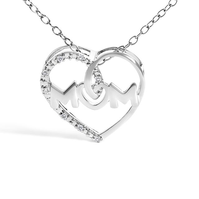 Crafted from luminous .925 sterling silver, this heart-shaped pendant is a loving tribute, masterfully incorporating "MOM"...