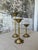 Elevate your tablescape with this elegant trio of vintage brass candlestick holders, each blooming with delicate petal-...