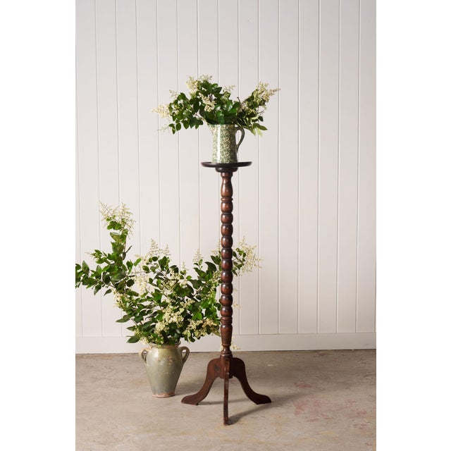 Antique English plant stand featuring classic bobbin detailing, elegant proportions, and rich aged patina