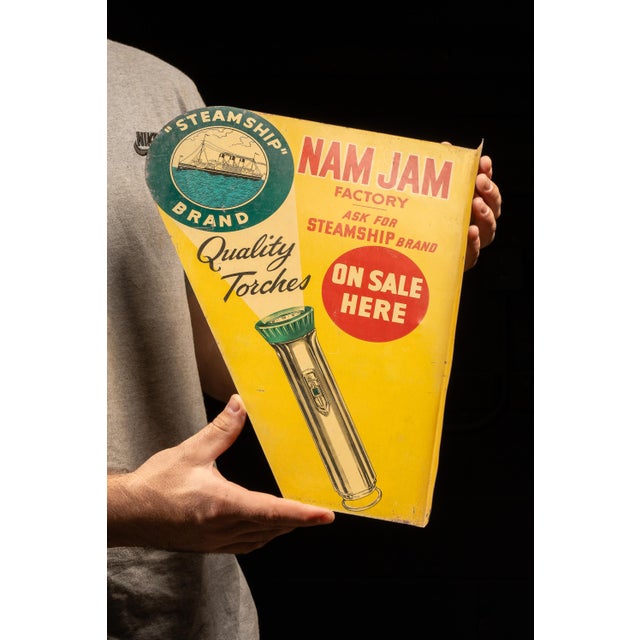 Mid-20th-century double-sided flanged advertising sign for Nam Jam Factory Ltd. of Hong Kong, promoting the company's...