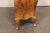 An Italian bombé style chest, with fabulous veneer exterior, from the mid 20th century. This vintage chest from Italy has...