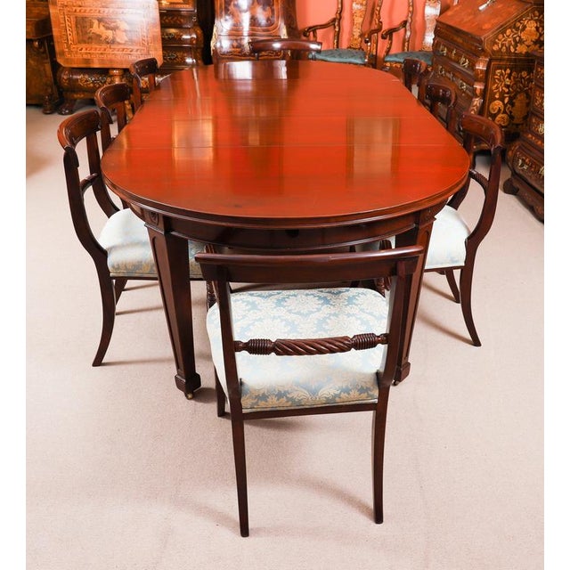 This is a fabulous antique Victorian oval mahogany extending dining table, circa 1850 in date with a superb set of eight...