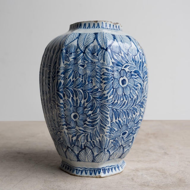 ANTIQUE DELFT POTTERY VASE /JAR A hugely decorative octagonal tin glazed earthenware vase with repeated floral and foliate...