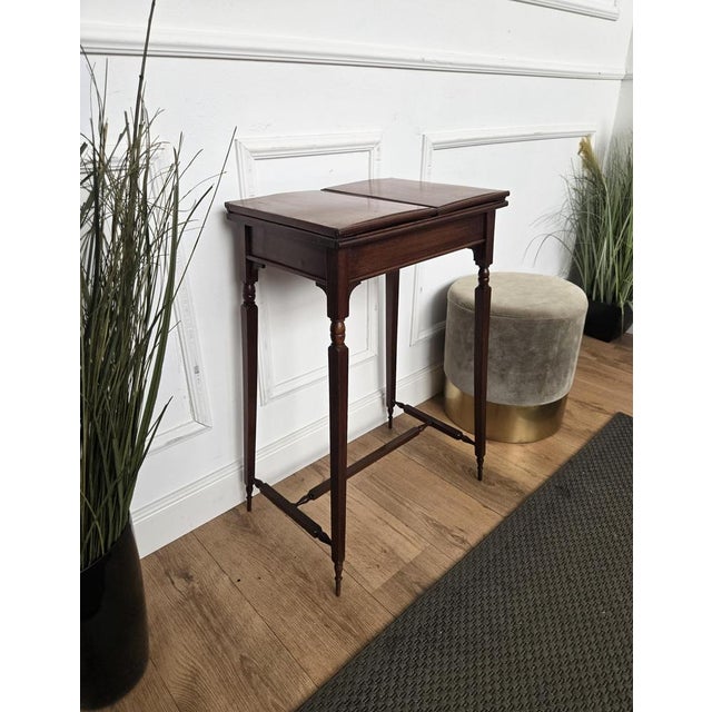 Beautiful Italian solid walnut corner side table with framed top over four classic carved decorated legs connected to one...