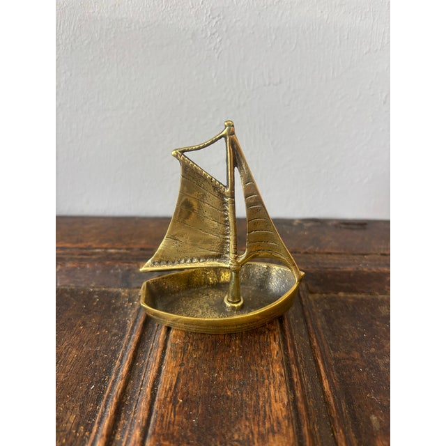 This charming vintage English brass boat is a wonderfully evocative decorative piece, rich with character and maritime...