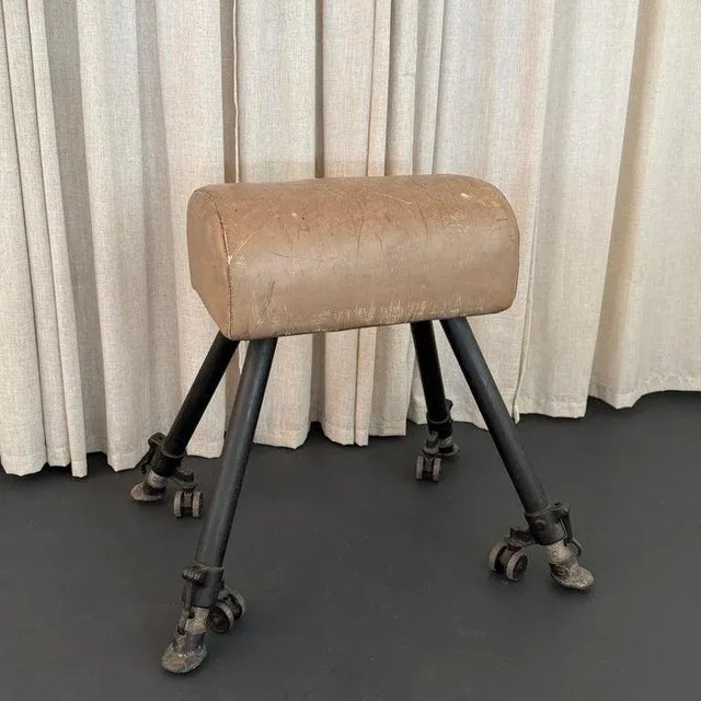 This 1920s height adjustable leather and cast iron pommel horse is an amazing antique gymnasium statement piece. The 22" w...
