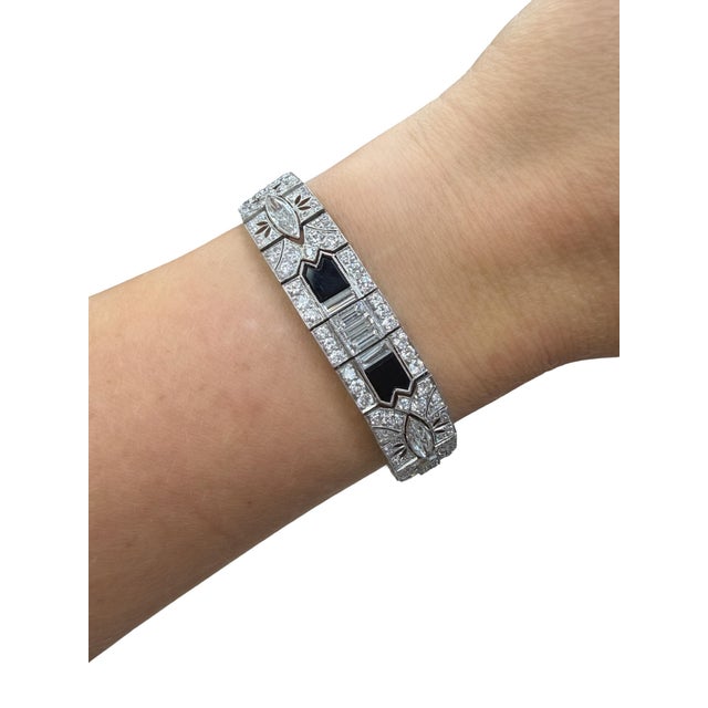 This stunning bracelet from the Art Deco era consists of four marquise cut diamonds weighing approximately 4.00 carats...