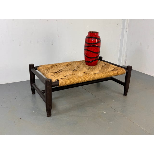 Vintage Wabi Sabi rope bench Ottoman. With a wooden frame and a woven rush top. Nice rustic piece which can be used as a...