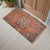 Vintage Turkish Hand-Knotted Small Rug from Oushak, 1970s. Authentic coral-orange accent mat featuring timeless Anatolian...