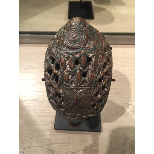 A Bamun prestige cuff from Cameroon. Made in the lost wax method from a bronze alloy, the pattern is completely unique and...