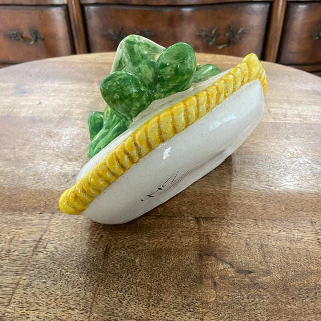 Whimsical little colorful frog, lounging on a pillow! Made in a majolica style with 3 dimensional details, colorful paint...