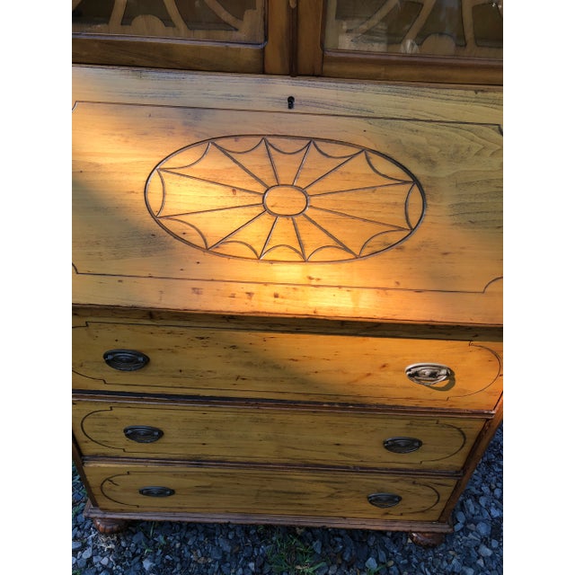 Pretty vintage American secretary cabinet having slant front desk that opens to a 29.5 d surface and cubbies with one...