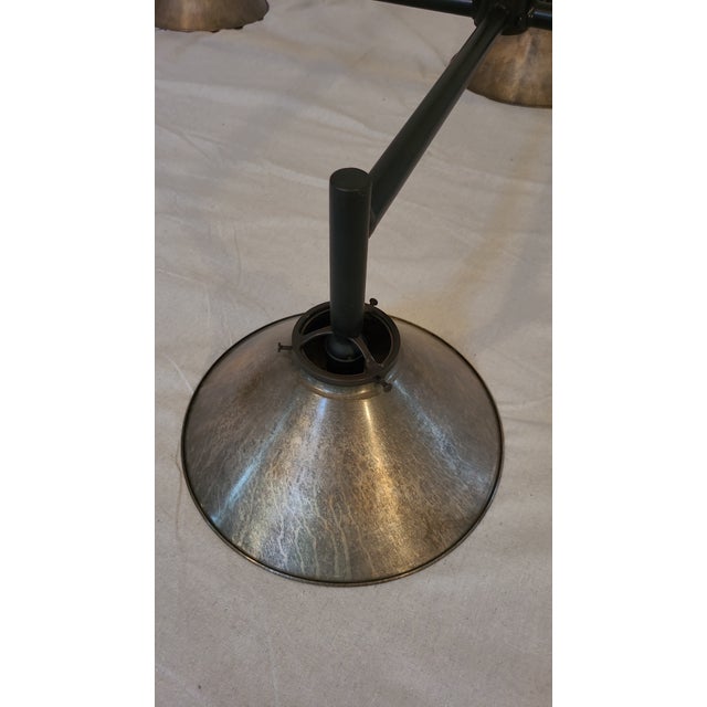 Unique chandelier with great patina on the 6 shades. Gives a custom feel over a dining or pool table. Currently is wired...