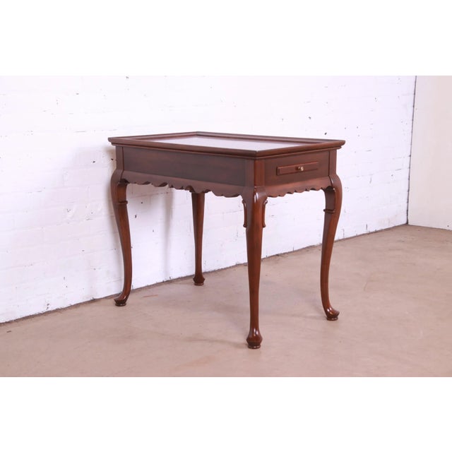 A gorgeous Regency or Queen Anne style nightstand, tea table, or occasional side table with pull-out trays By Ethan Allen...