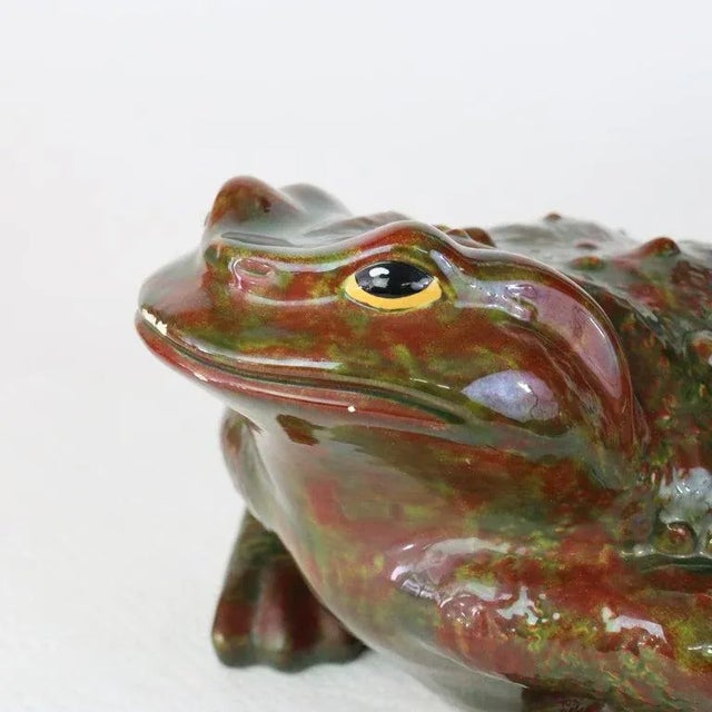 Antique Majolica School Pottery Garden Toad C1930. Measures - 7.75"H x 10"W x 13.25"D. The frog is crafted with a glossy,...