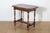 A charming 19th-century French side table crafted from solid wood, showcasing the craftsmanship and style of the period....
