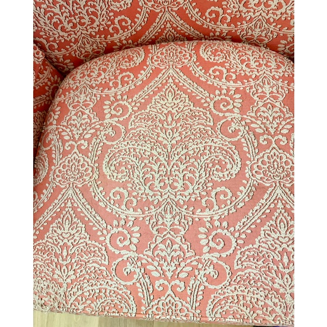 Elegant Ethan Allen accent chair featuring a classic high-back silhouette upholstered in a richly textured coral and cream...