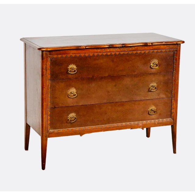 An elegant early 20th-century three-drawer chest by the Robert W. Irwin Furniture Company of Grand Rapids, Michigan, circa...