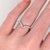 A graceful curved chevron band crafted in solid 14K gold, featuring a sparkling arrangement of marquise and round diamonds...