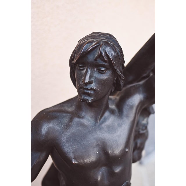 By Eugene Marioton, 'Young Hercules', bronze The figure is depicted standing, wrapped in a lion's skin, with his left arm...