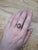 A star ruby glows in a deep red lit by a silver star at the centre of this solid 14K yellow gold ring, encircled by fifty-...