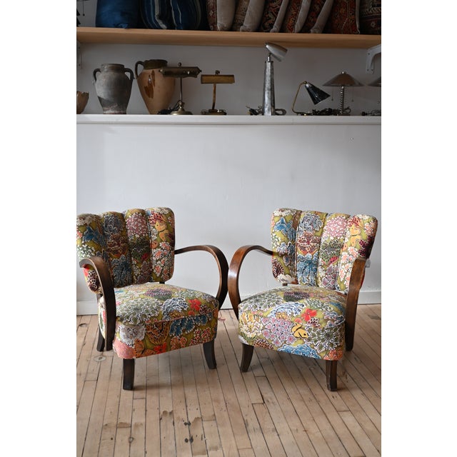A sophisticated pair of Jendrich Halabala Armchairs. Petite with classic bentwood arms and a channeled back, all freshly...