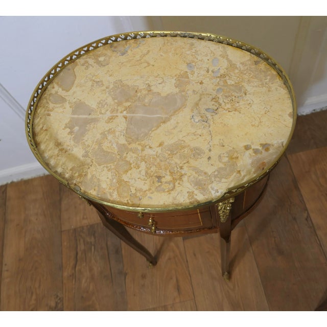 A Pair of French 19th Century Oval Side Tables or Bedside Cabinets This is a superb quality pair of French side tables,...