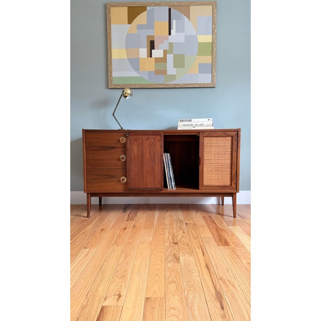 Fully refinished to showcase the gorgeous walnut grain. Featuring 3 dovetailed drawers on the left with signature brass...