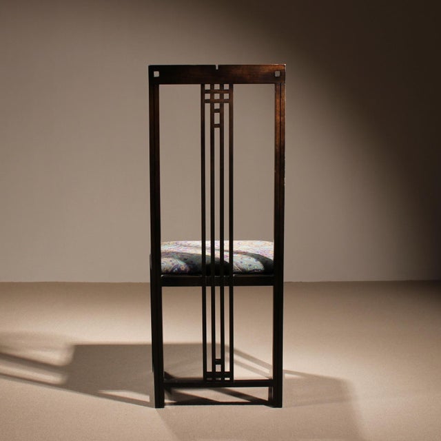 ​This elegant high-back chair by Umberto Asnago for Giorgetti is a striking example of 1980s postmodern design. The...