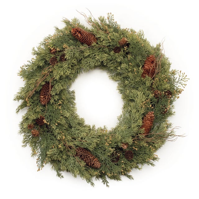 Bring a touch of rustic elegance to your holiday decor with this Pine and Pinecone Wreath. Featuring lush green pine...