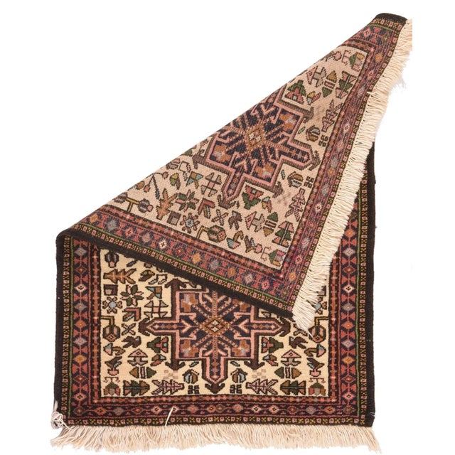 The characteristic Karaja pattern of octogrammes and hooked hexagons is exemplified by this small scatter in brown-black...