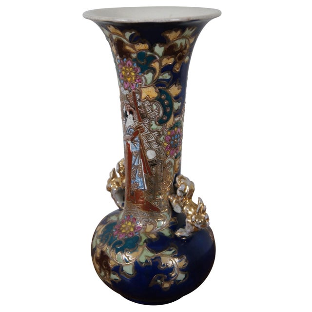 "Late Meiji era Kutani vase, circa 1903. A beautiful porcelain blue ground centered by an intricate Geisha flanked by gold...